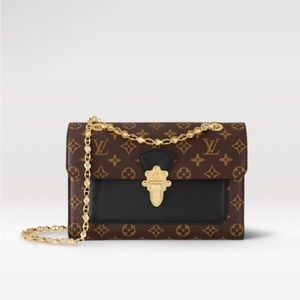 Louis Vuitton Victoire canvas handbag